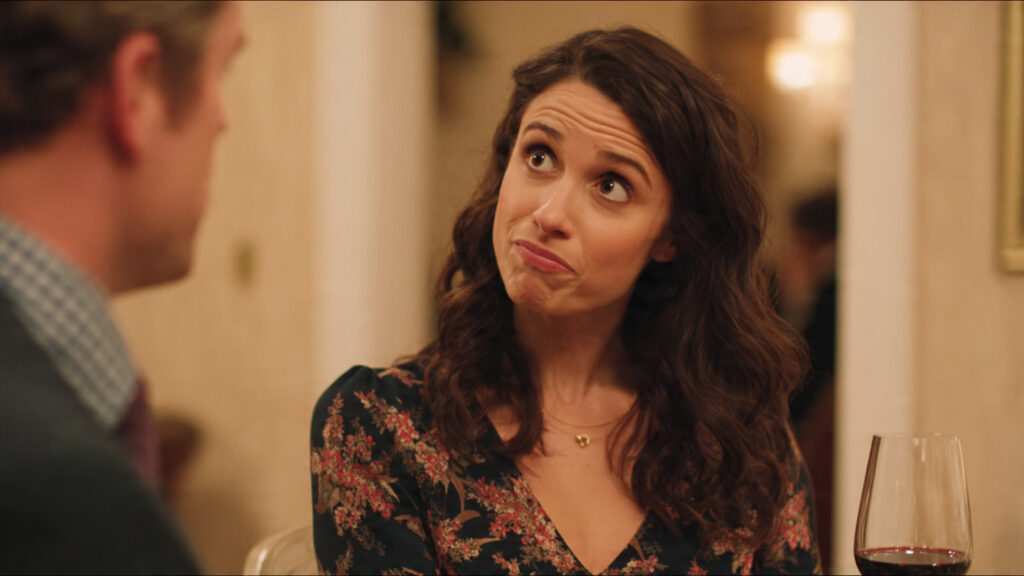 A still from a show that exemplifies awkward social situations or sharp dialogue.