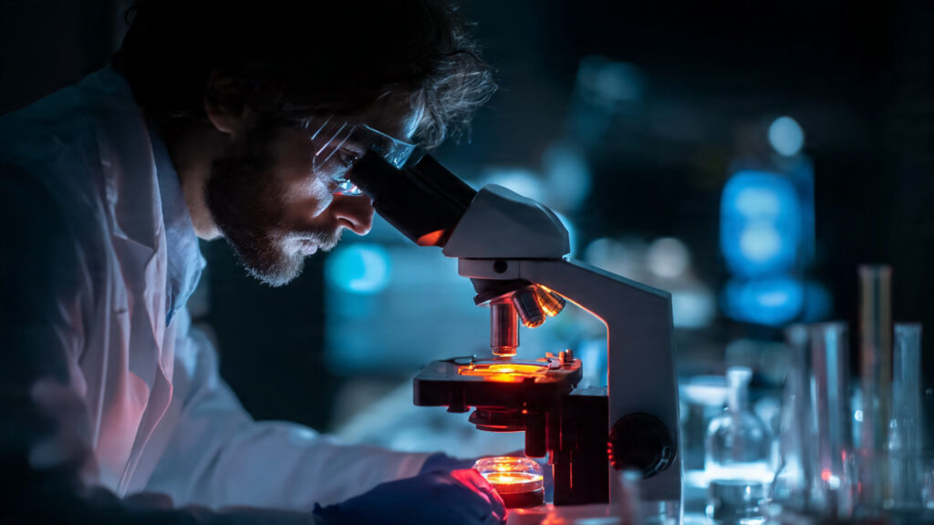 The Evolution of True Crime on Streamers: From Reenactments to Empathetic Investigations 3 close-up on a forensic scientist examining evidence under a microscope in a dimly lit lab