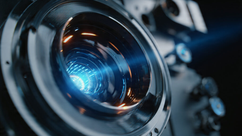 Action Movies 2026: Full Movie English – Top 10 Blockbusters Streaming Now 4 Close-up shot of a high-tech cinematic projector lens, symbolizing the technology behind modern film viewing.
