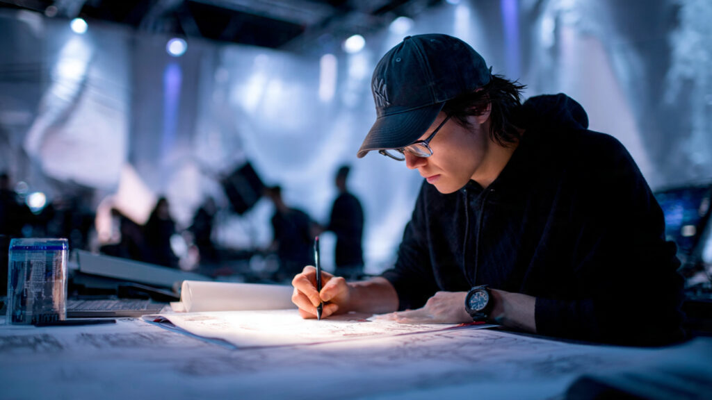 The Art of the Stunt: Why 2026 Action Hero Psychology Cinema is Redefining Heroism 2 A behind-the-scenes shot of a stunt coordinator meticulously planning a complex practical effect on a set.