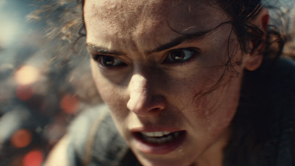 Close-up of a character's determined expression during a high-stakes moment, with blurred action in the background]