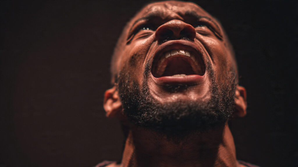 Close-up shot of an actor emoting powerfully, hinting at a significant performance