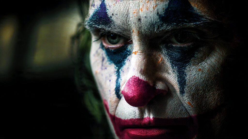 The Power of Mind: A Deep Psychological Movie Analysis of Joker 3 Arthur Fleck performing stand-up comedy at a dingy club, his act failing, highlighting his desperation and isolation.