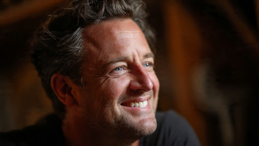 Photo of Matthew Perry smiling warmly